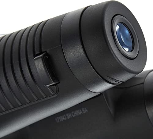 Close-up of a binocular eyepiece